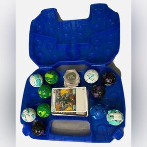 Large Bakugan lot of 11 with blue case and cards